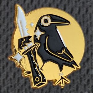 Black and Gold Raven Holding a Dagger Enamel Pin